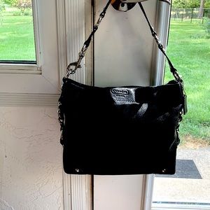 Coach - leather. Short (17 in) handle. Light weight. Like new!